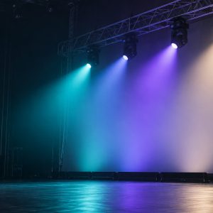 LED wash moving head lights creating broad teal, violet, and warm white stage coverage.